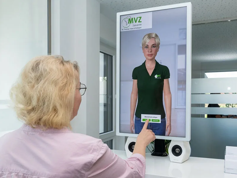 Digital practice concierge on a touch terminal at the reception of a dental medical centre